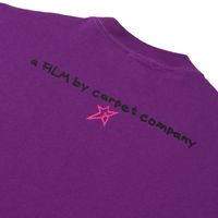 Back of purple tee with text reading a FIM by carpet company