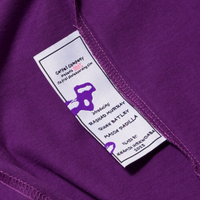 Inside of purple with washtag showing details about the Carpet film BRAT