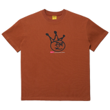 Brown tee with Face on the front and text reading "Brat a film by carpet company"