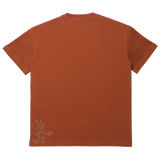 Back of a brown tee with small character on the bottom left